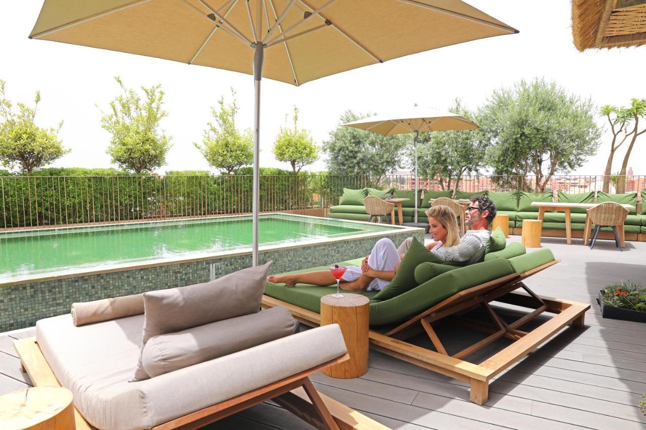 Hotel Jadali & Spa マラケシュ エクステリア 写真 The pool at the hotel